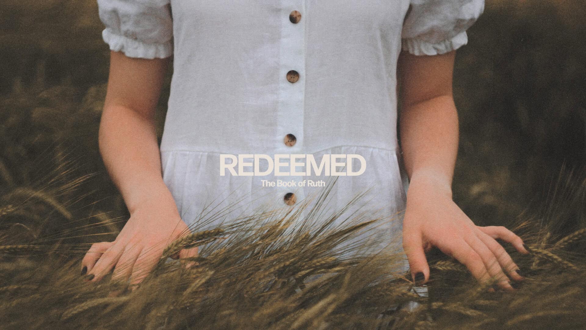 Woman in a white dress stands in a field with "REDEEMED: The Book of Ruth" text overlay.